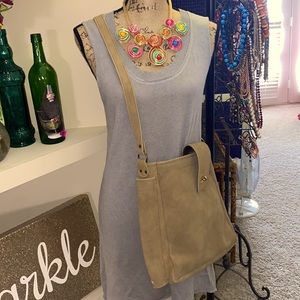 Vintage leather satchel with black umbrella